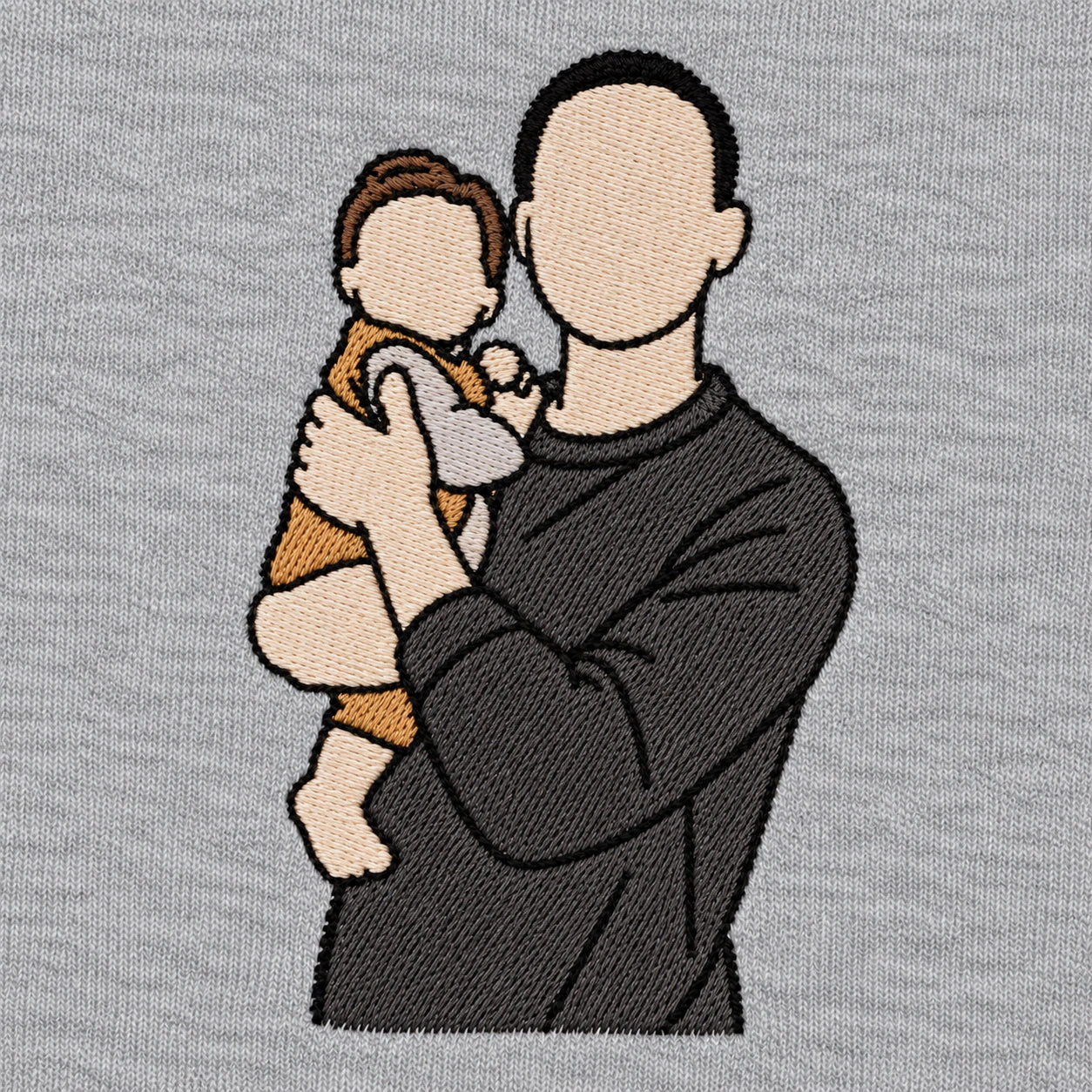 Father and baby recreated in embroidery