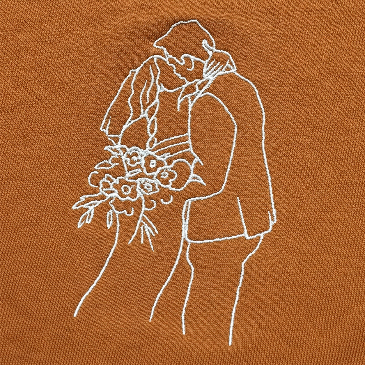 Wedding couple recreated in embroidery